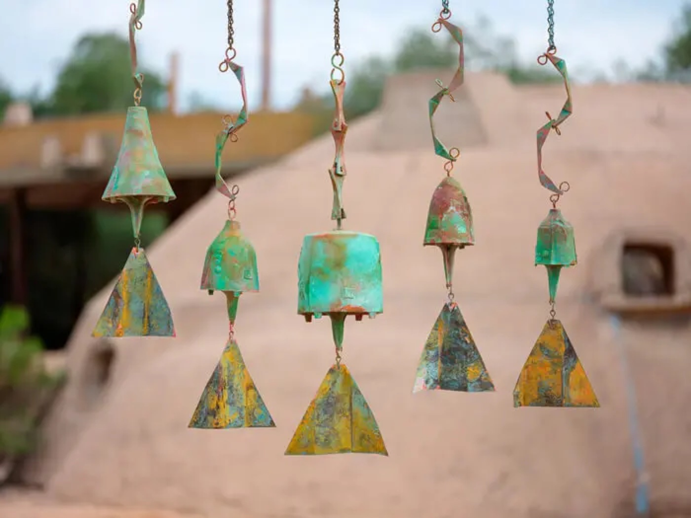 Cosanti Originals bronze windbells, hand-cast and patinated. The single largest revenue line, booked as 'assignment of rights.'