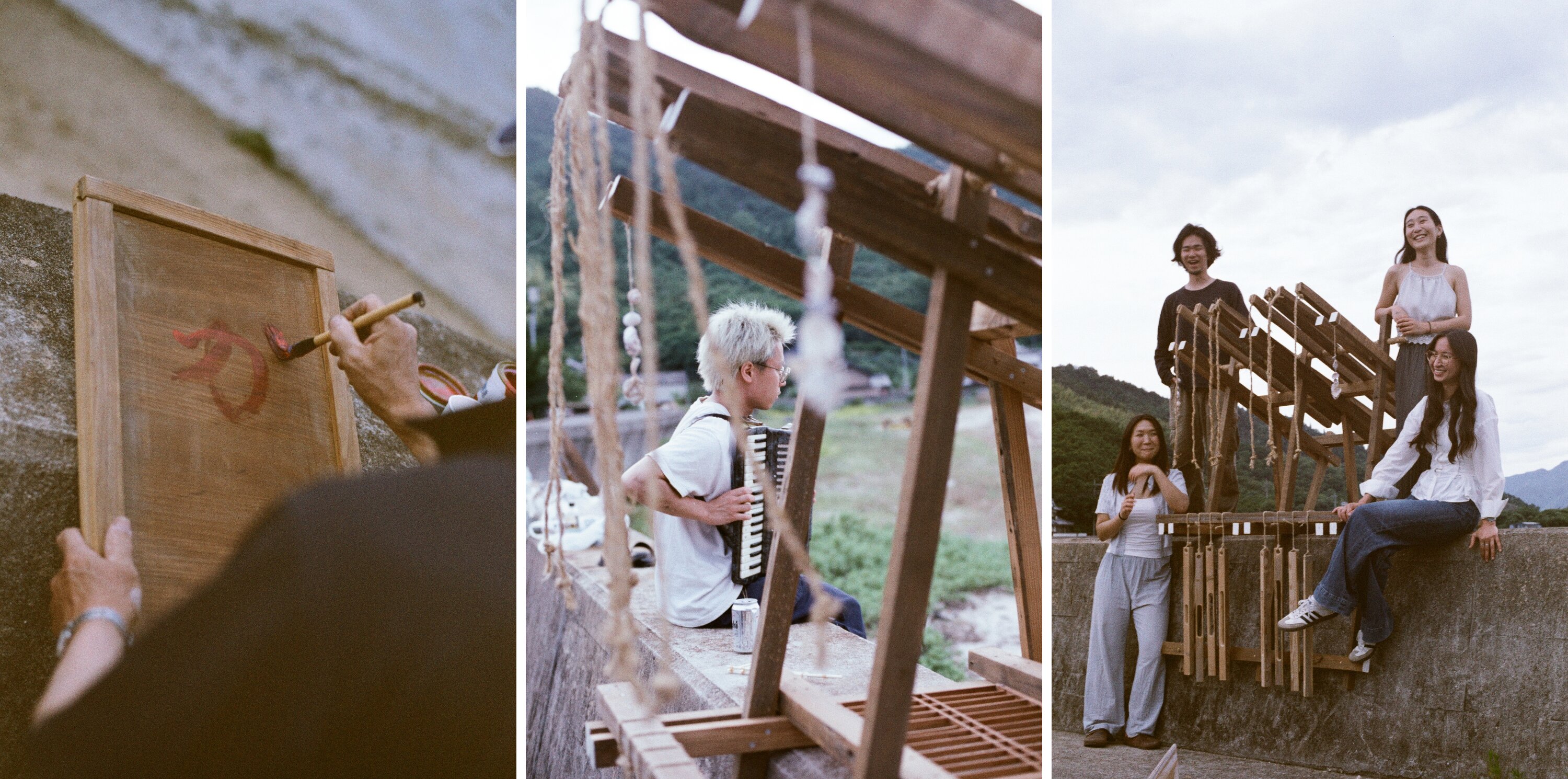 Three panels made on the seawall at dusk: hands brushing a red mark onto a framed wooden panel, a studio member playing an accordion beside the timber rack, and four studio members with the finished rack they built