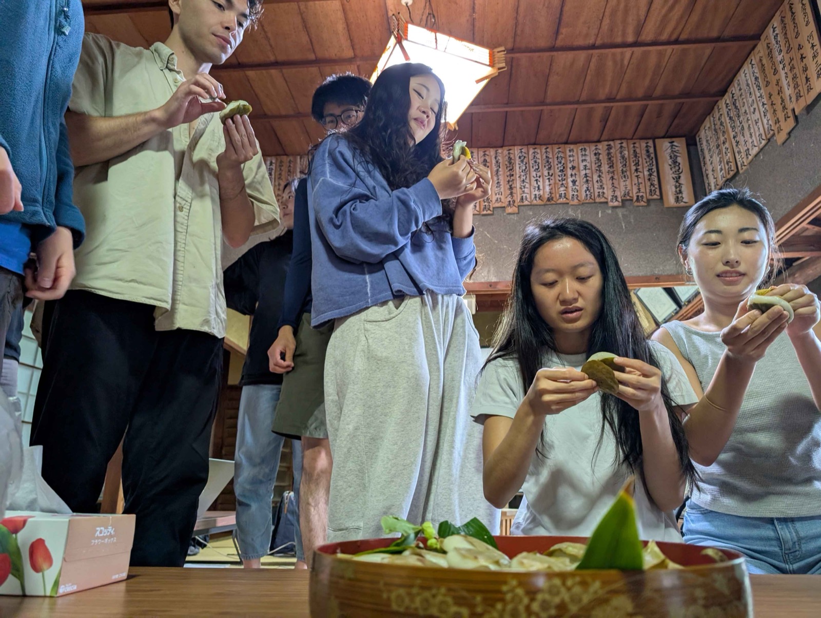 Studio participants tasting kashiwa-mochi made by the island's grandmothers.